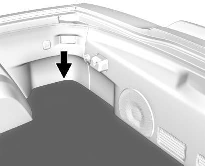 286 Vehicle Care 4. Open the hatch/trunk and lift the carpet on the passenger side of the vehicle to gain access to the battery cover. 5.