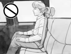 {CAUTION: Never do this. Here a child is sitting in a seat that has a lap-shoulder belt, but the shoulder part is behind the child.