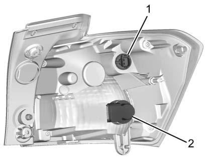For the passenger side, remove the air cleaner cover. 3. Remove the cover from the back of the headlamp assembly by turning it counterclockwise. 4. Disconnect the electrical connector. 5.