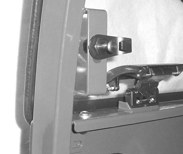 With assistance, install the windshield hinges to the windshield support with the two spacer blocks between the hinge and the windshield support.