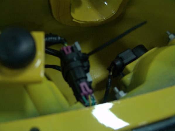 Figure 38 33. Reinstall both license lamps and license plate with two screws. 34. Push up the rear seat. 35.