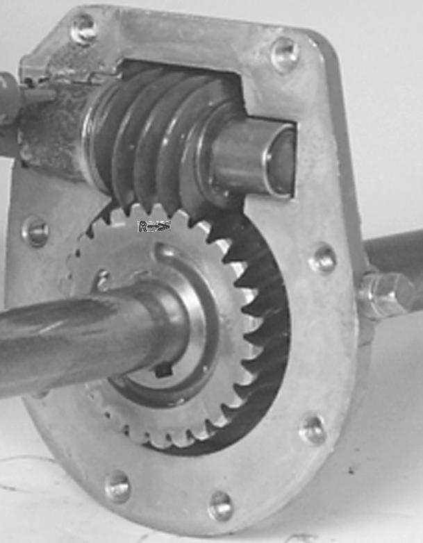 Auger Gearbox Service 3. Insert the keys into the shaft and slide the large worm gear into place. Note: There is a large letter R and an arrow on one side of the gear.