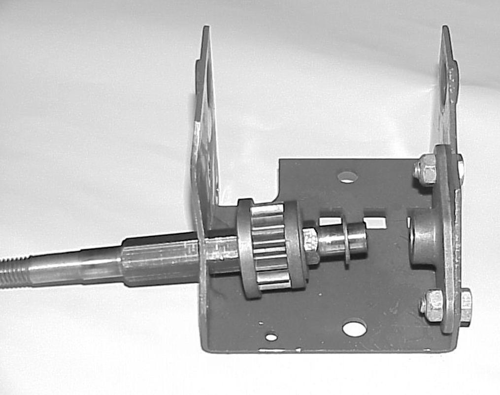 Slip the shaft through the left side of the sliding bracket (Figure 02). Figure 02 Figure 00 6.