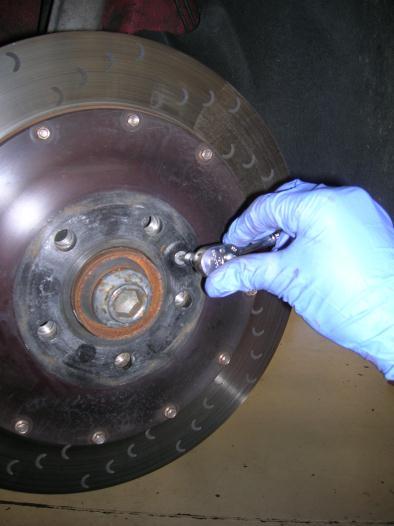 7 Install the new rotors making sure they are free of dirt and grease. Tighten the rotor retaining bolt to 48 in-lbs.