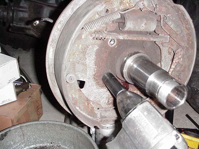2. Remove the brake shoes and release the brake cable from