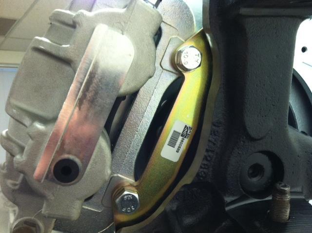 Install the caliper assembly to the bracket using the supplied M12-1.75x30 bolts and washers.