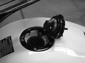 Fuel Cap Use the ignition key to lock and unlock the fuel cap. Always lock the fuel cap before riding. An open fuel cap could contact the handlebar. To open the fuel cap, lift the lock cover.