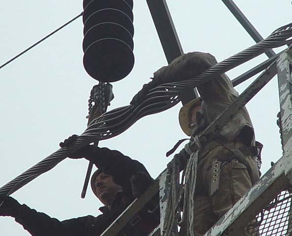 The chain hoist and strap are then removed.