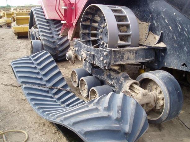 The best way to remove the tracks is to work the track off the inner idler wheels while at the same time working the drive lugs out of the drive wheel