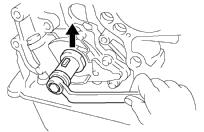 Hold the hexagon wrench head portion of the camshaft with a wrench, and tighten the timing sprocket bolt.