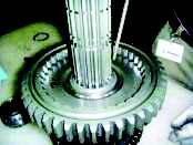 15. With clutching teeth up, install the 1st gear on the shaft against previously installed gear. 16.