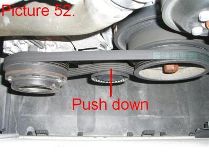 Push the tensioner pulley between the AC compressor and the crank straight down and slide the