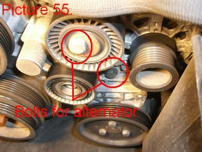 Locate and unbolt the two bolts holding the alternator using a 16mm socket (Pic.55).