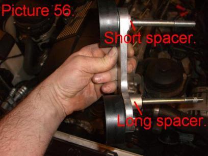 The spacers, pulleys and the bolts are preassembled to the bracket. The short spacer goes on the top hole.