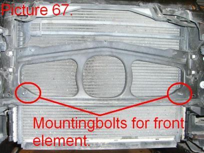 It is mounted in 4 plastic bolts / clips. There are two on each side near the head lamps (Pic.66).