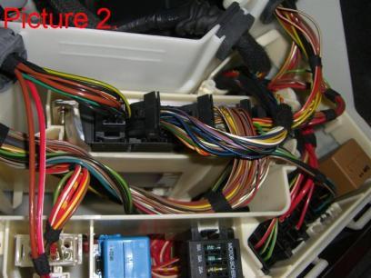 Start disconnecting the connectors from the fire wall side and towards the front of the car (Pic.2). Press the small tab and rotate the levers on the larger plugs to remove.