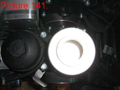 - 10mm socket - 13mm socket Remove the cap and mounting bracket from the original power steering reservoir.