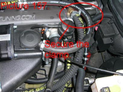 Fill the hose with coolant mixture (½ BMW coolant with ½ distilled water) until it pores out of the free connection on the inlet manifold (Pic.156) Push the hose onto the free connection.