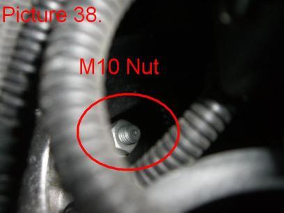 Unbolt the plastic nut holding the positive battery cable feed to the starter on the intake (Pic.