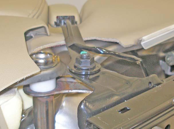 10. Remove the J-clips for the side of the seat cushion from the seat pan. Figure A10 11. Remove the nut securing the seat belt buckle to the seat frame assy.