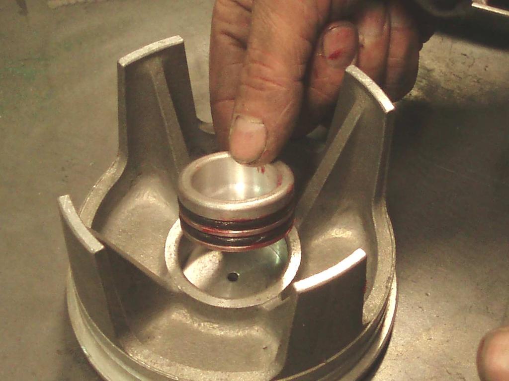 Apply rubber grease to O Rings and fit O Rings to valve piston, cover O Ring outer