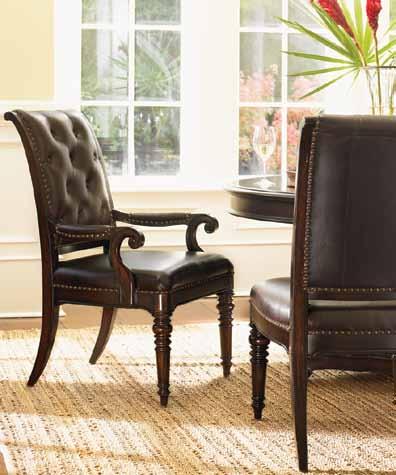 The Hastings arm and side chairs feature leather seating with nailhead trim.