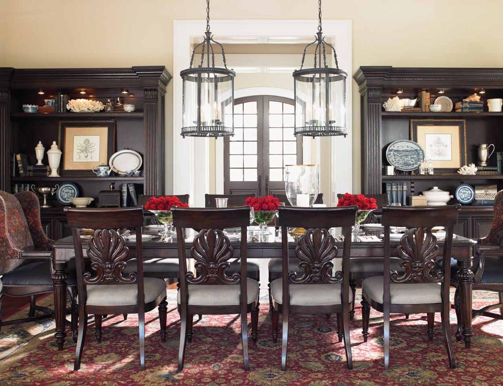DINING ROOM y The Kensington dining table offers elegant seating for ten, highlighted by the hand carved detail on the backs of the