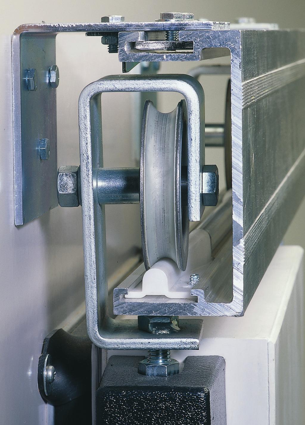 Micro leveling (G) allows for vertical door adjustment to maintain door seal; adjustment nuts are located for easy access.