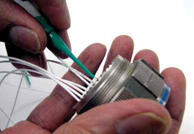 After all contacts are inserted, fill any empty cavities with wire sealing plugs. 6. Reassemble plug or receptacle hardware slide forward and tighten using connector pliers.