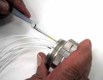 Grip wire and simultaneously remove tool and contact. (On occasion, it may be necessary to remove tool, rotate 90 and reinsert.) Removal of SCREW CONNTOR CONNTOR contacts with metal tool.