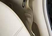 Pull the strap to release the head restraint forward.. Stow the 3 rd row seat belts in the seat belt hooks found in the cargo area. 3. Pull up on the latch located on the corner of each seatback and lower the seatback forward over the seat base 3.