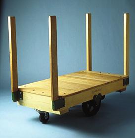 PLATFORM TRUCKS FACTORY to 2,500 lbs. Stacked loads move easily, as this truck is tilt style and turns in its own length. Four removable wooden stakes 1-1/4 x 2-3/4 sit into steel corner pockets.