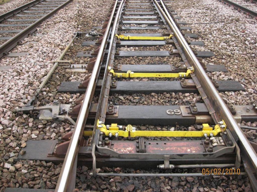 The track bed is made up of large stones known as ballast, this is compacted by hand using kango machines or a S&C (switch and crossing) tamping machine.