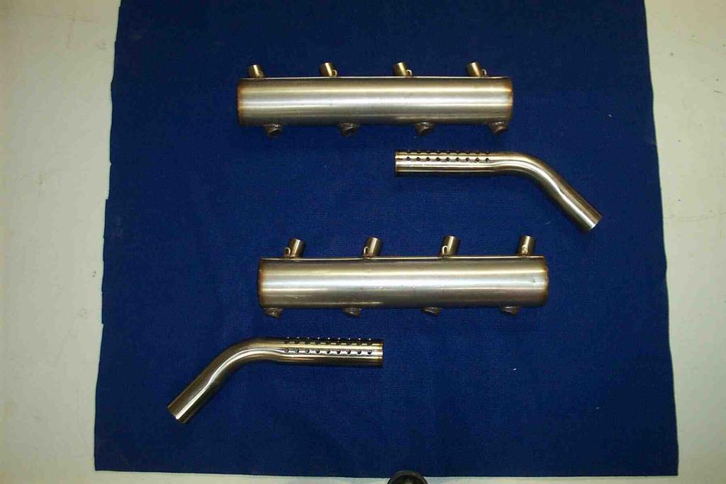 " An exhaust system is provided with the engine. Some modification may be required to suit your particular installation.