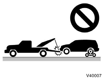 (c) Towing with sling type truck Emergency towing NOTICE Only use specified towing eyelet; otherwise your vehicle may be damaged. Never tow a vehicle from the rear with four wheels on the ground.