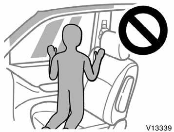 Do not allow anyone to kneel on the passenger seat, facing the passenger s side door, since the side airbag and curtain shield airbag could inflate with