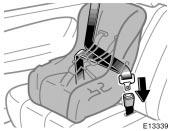 1. Run the lap and shoulder belt through or around the convertible seat following the instructions provided by its manufacturer and insert the tab into the buckle taking care not to twist the belt.