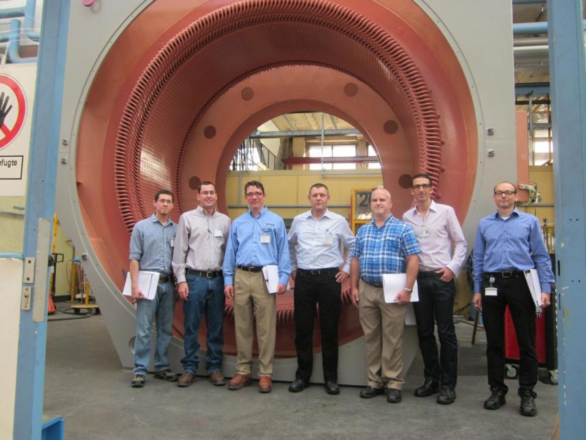 The project team from Siemens and ThyssenKrupp in front of the stator of the largest gearless conveyor motor in the world. This press release and press pictures are available at http://www.siemens.