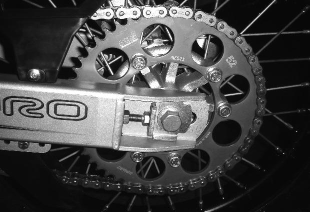 TRANSMISSION CHAIN ADJUSTING AND LUBRICATION To correct the chain tension, loosen the rear axel bolts and turn the adjustment plates of the rear wheel axle clockwise to tighten the chain and