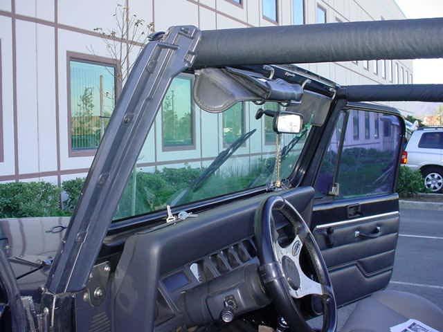 If you are replacing a hardtop, use the Windshield Channel as a template to drill 1/8 holes. Figure 1 WARNING: Ensure Windshield Channel is properly secured prior to installing the Soft Top.