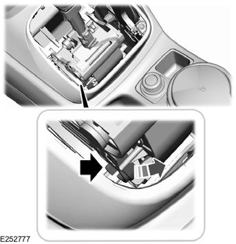Transmission 2. Using a screwdriver or similar tool, depress the white brake shift interlock override until the blocker moves. 3. Move the transmission selector from park (P) to neutral (N). 4.