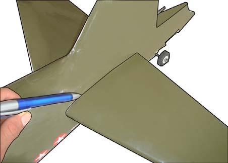 www.seagullmodels.com 2) Using a modeling knife, carefully remove the covering at mounting slot of horizontal stabilizer. Remove the covering.