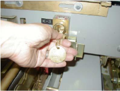 15 the latch handle must be pulled forward to allow the blocking plate on the slider to pass above the latch handle. Key KC is rotated in Key Figure 3.4.14 Lock K3. See Figure 3.4.15. Remove G&T Device From Breaker Cell 15.