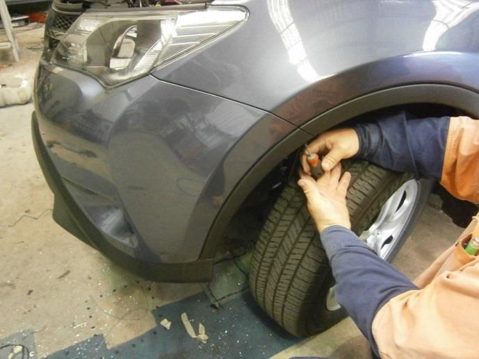Using a 10mm socket, remove the outside clips from the top of the bumper Remove the
