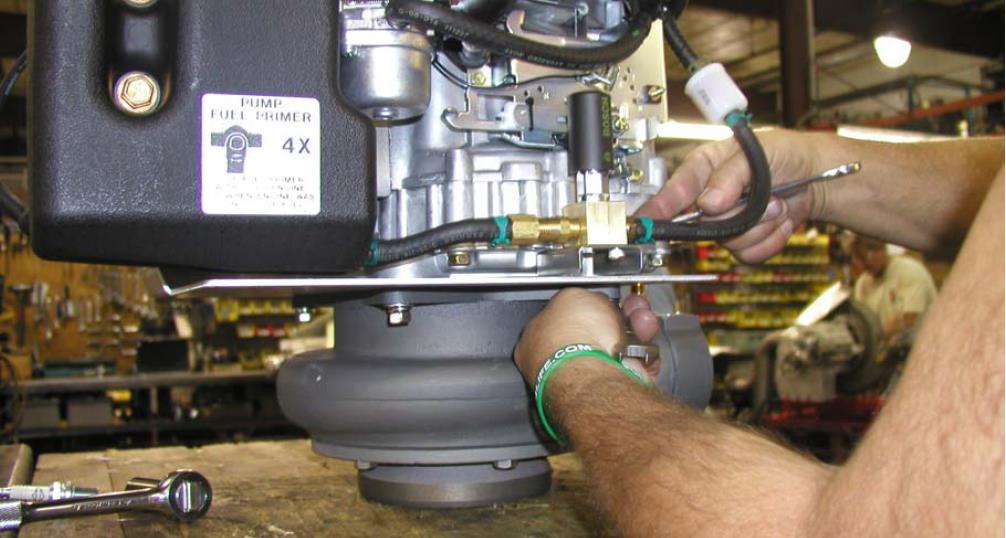 Tighten the four fasteners that hold the pump assembly to the engine evenly in an alternating opposite corner pattern to prevent cocking of