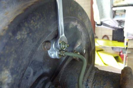Step 8 Open (turn counterclockwise) the bleeder screw at the right rear wheel, 1/3