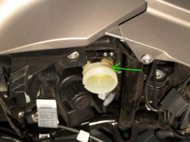 Keep doing this until the fluid flows cleanly, and you are done. It usually takes 2-3 fills or more to get all the old fluid out. Fill to the upper level line, install the cap, and you are done!