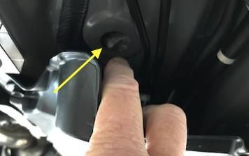 Then remove the 1 rubber grommet under the driver seat: marked with a
