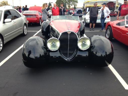 This car is built by Delahaye USA. You can check it out on their web site at www.delahayeusa.com. The radiator and cut-down windshield recall the Bugatti Type 57SC.
