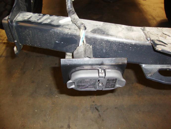 Retain the nuts and bolt plates to install the bumper replacement brackets and reinstall the factory receiver hitch.